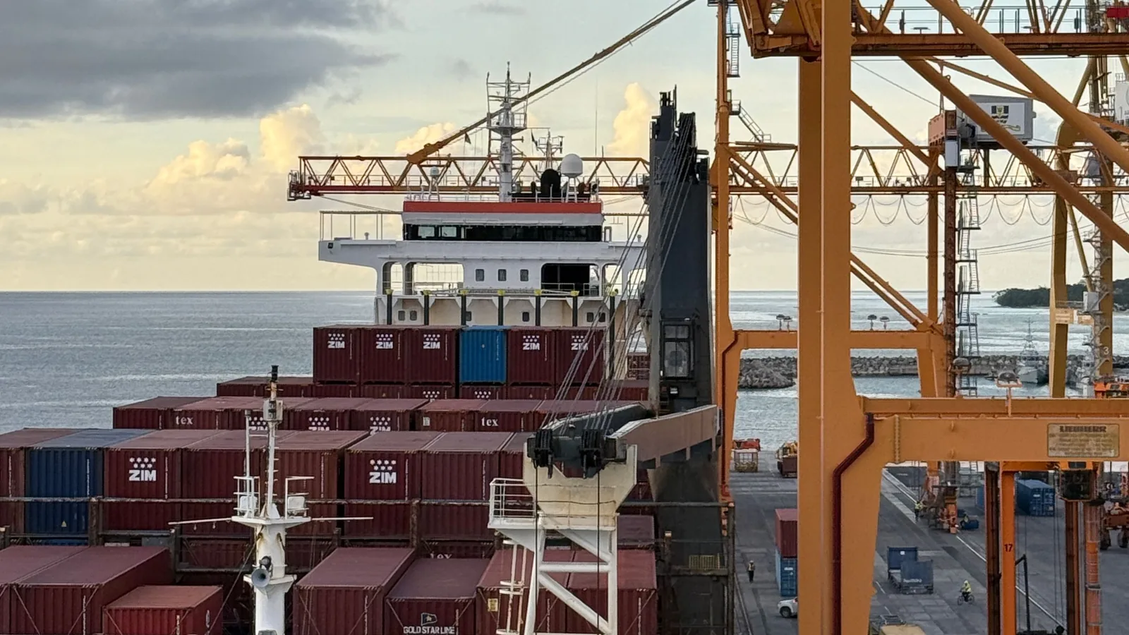 International shipping route hub with container ships and cranes