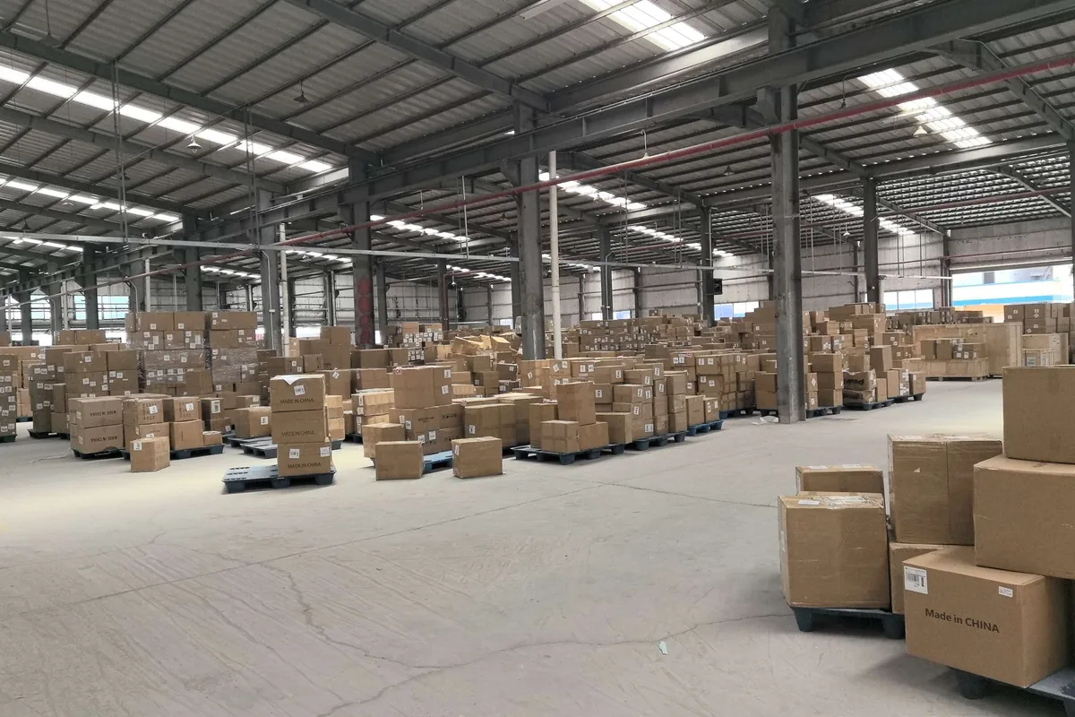 XCJD export warehouse with palletized cargo ready for DDP door-to-door delivery